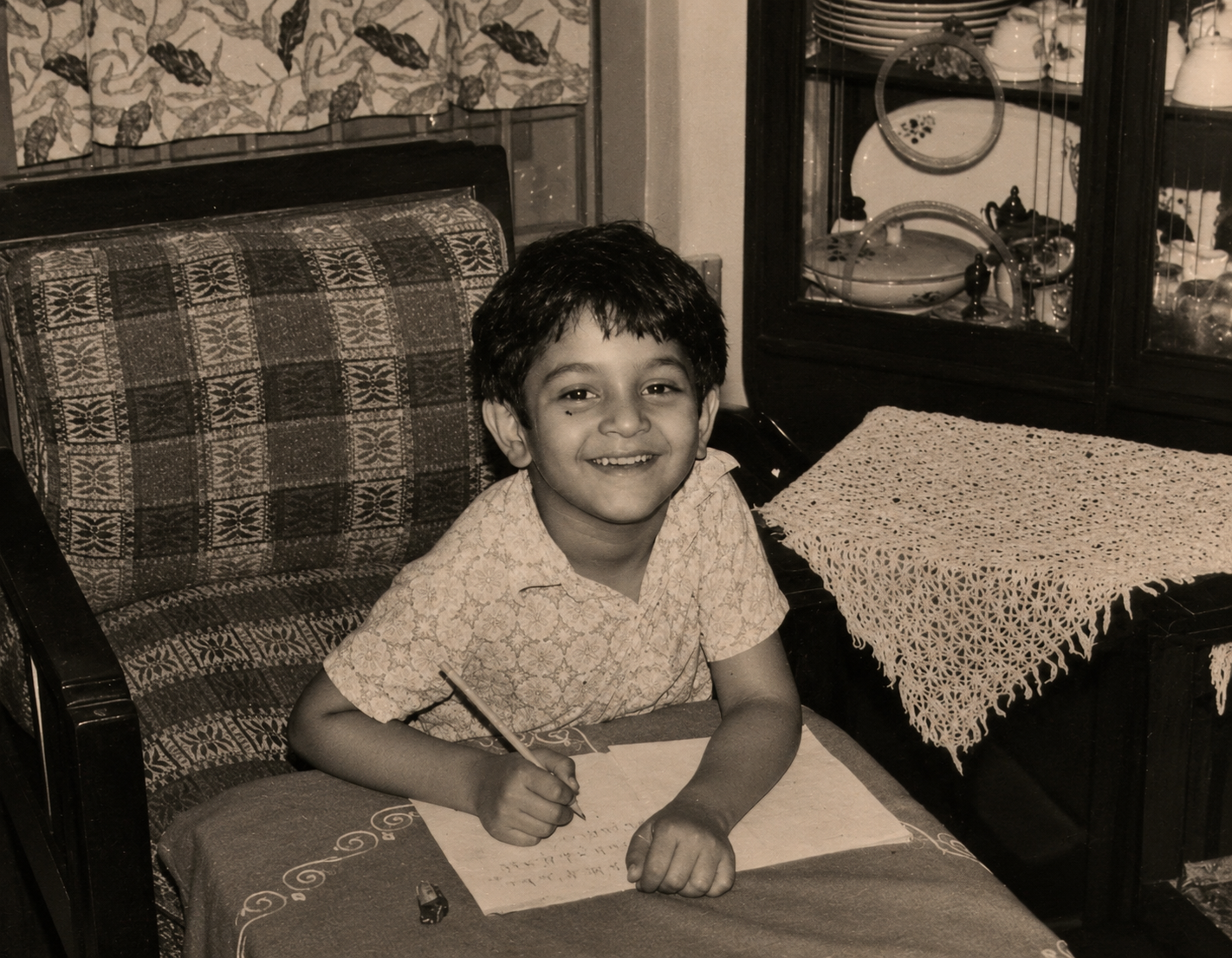 Sanjay Ray doing homework during childhood